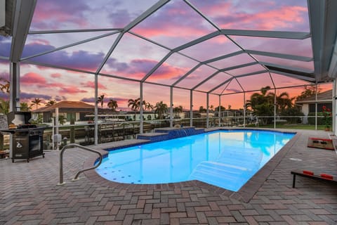 screened in pool cage with heated pool