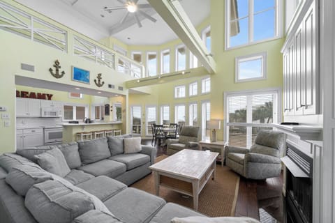 Signature House, 6 Bedrooms, Balcony, Beach View | Living room | 65-inch Smart TV with cable channels, fireplace