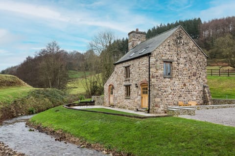 Absorb the tranquil sound of the stream which runs past Shepherd's Cottage, Usk, Monmouthshire