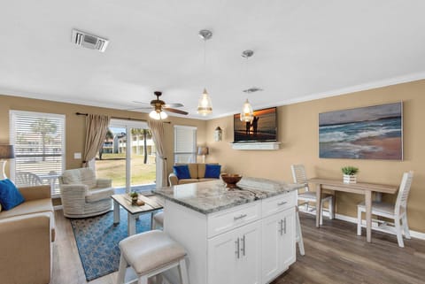 Open floor plan with flat-screen TV in the living room
