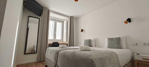 Twin Room, 2 Twin Beds | In-room safe, desk, laptop workspace, blackout drapes