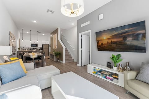 Spacious layout connecting living, dining, and kitchen.