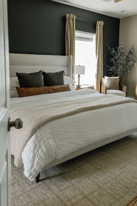 Rest in a serene king suite with an ensuite bath and cozy design. 