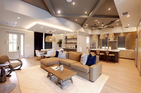 Living Room/Dining Room and Kitchen open concept with all Restoration Hardware Furniture. Luxury and Relaxation at its best