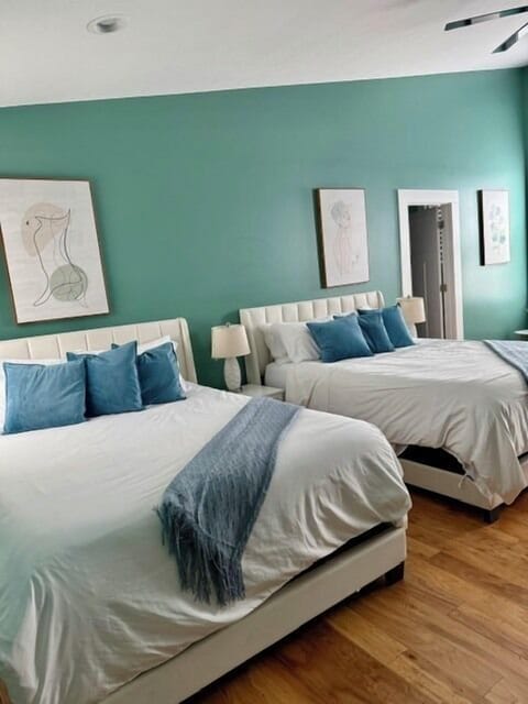 Bedroom 1 with two queen beds and large ensuite bathroom