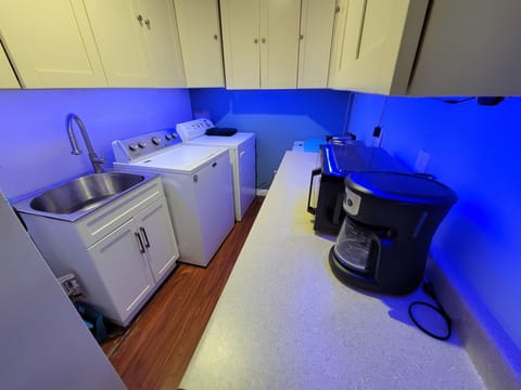 Kitchenette area with Full size fridge and washer and dryer