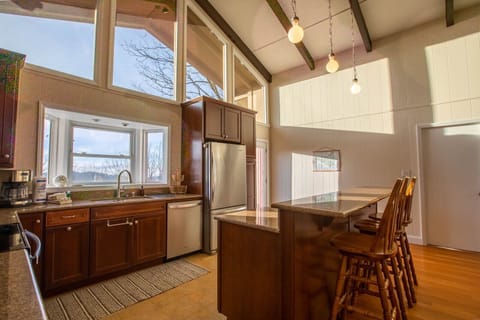 Kitchen with Bay Window, Stainless Appliances and Center Island