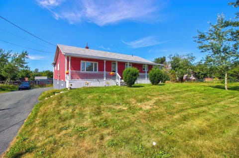 Nestled Amid Nature's Beauty: Immerse yourself in the tranquil embrace of Conception Bay South, where this charming retreat offers a haven of relaxation and rustic allure, inviting you to unwind and find solace in its peaceful surroundings