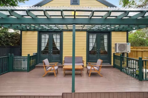 Gorgeous private backyard with a pool, hot tub, and covered seating area. The pool and hot tub are kept operational year-round.