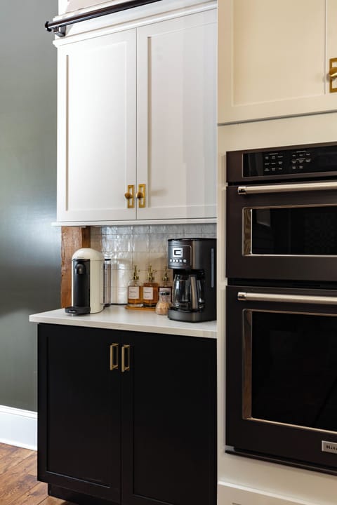 The kitchen boasts a fully stocked coffee bar w/ drip coffee maker & Nespresso 