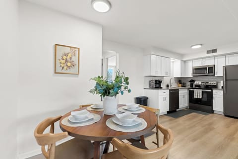 Dine in comfort at this cozy round table set for four, just steps from the kitchen.