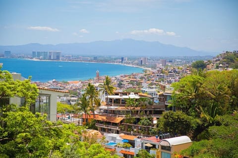 Enjoy stunning views of the bay, city, & surrounding mountains from the balcony.