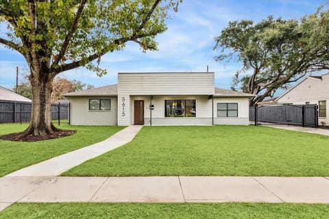 Street view of the luxurious modern home you'll stay in