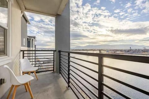 Step onto your private balcony and take in the stunning marina and mountain views—an ideal spot to relax and enjoy the peaceful waterfront ambiance.
