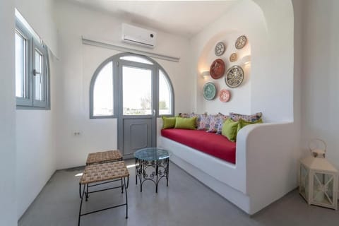 Triple Room, Pool View, Sea Facing | Living area | Flat-screen TV