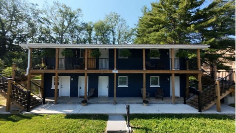 Exterior View: A calm, nature-filled escape framed by tall trees and grassy landscapes—an ideal place to relax and take in the soothing outdoor vibe.