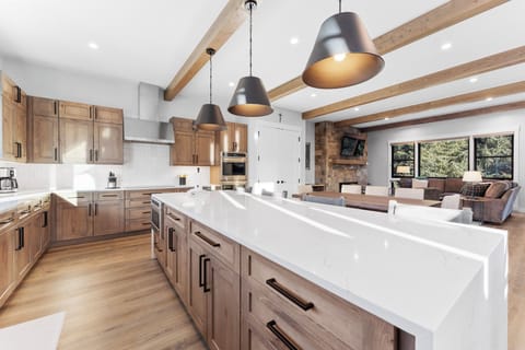 Full kitchen with quartzite counters. Smart appliances, and huge prep area!