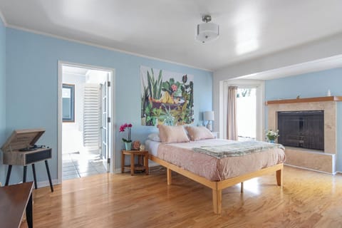 Large and bright master bedroom with kitchenette, bathroom and patio!