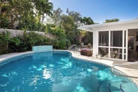 Easy access into the private and heated concrete pool.