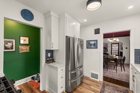 Stunning white cabinets, gleaming stainless steel appliances, and a gorgeous backsplash!  This kitchen is a dream come true. 😍 #dreamkitchen