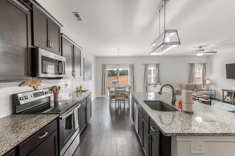 Kitchen, dining room with seating for six and slider to patio