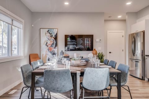 A Cozy Dining Room Retreat with Stylish Decor and Ample Seating