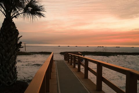Beachfront sunsets + private boardwalk beach access + resort amenities = one perfect beach getaway!