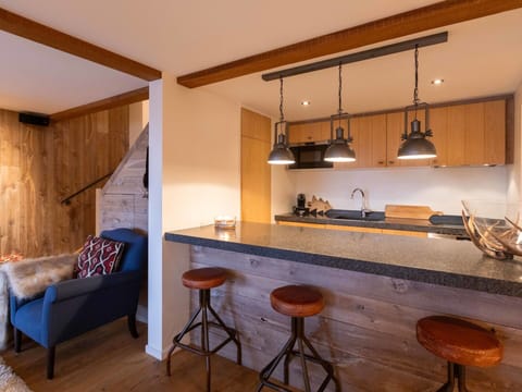 Furniture, Interior Design, Wall, Flooring, Countertop, Wood, Kitchen, Ceiling, Floor, Light Fixture