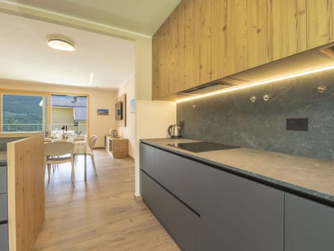 Interior Design, Ceiling, Kitchen, Flooring, Countertop, Room, Floor, Cabinetry, Light Fixture, Tap