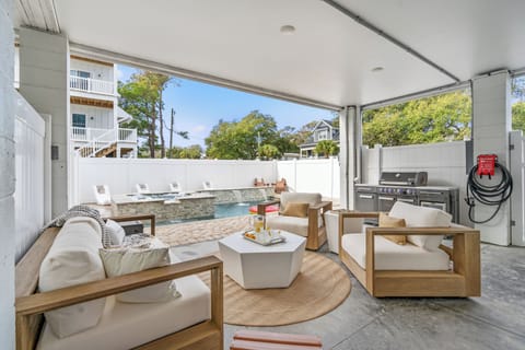 Elevate your outdoor experience with our stylish covered patio and lounge area