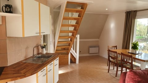 Kitchen and dining areas with stairs to bedrooms