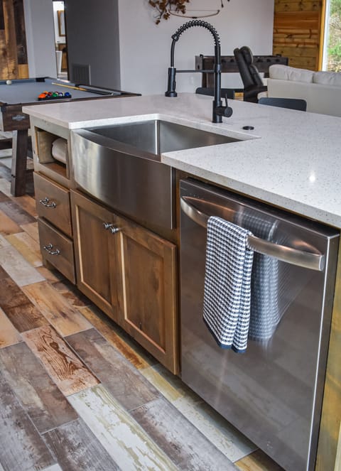Enjoy the big farm style sink and dishwasher, giving you more relax time.