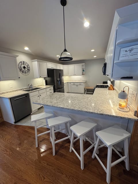Gourmet Kitchen with counter and 4 stools