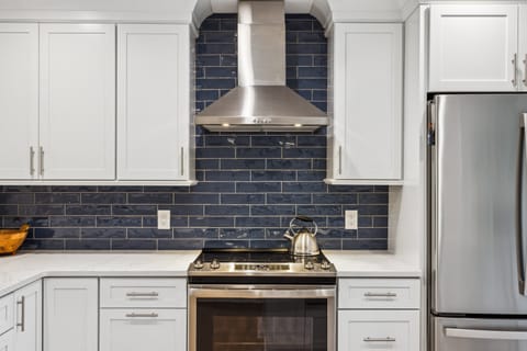 Fully stocked kitchen with stainless steel appliances