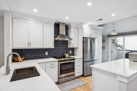 Fully stocked kitchen with stainless steel appliances