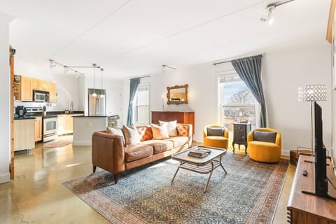 Living room with lots of comfortable seating and a Queen Murphy Bed. Brand new furnishings and lots of natural light in this centrally-located condo.