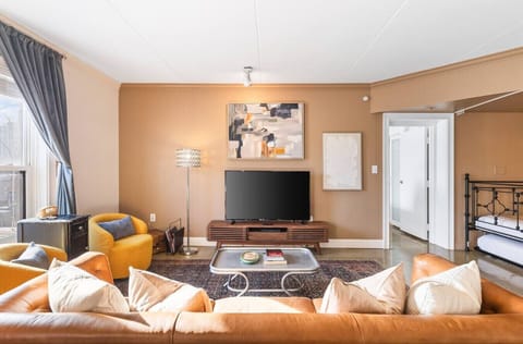 Living room with lots of comfortable seating and a Queen Murphy Bed. Brand new furnishings and lots of natural light in this centrally-located condo.