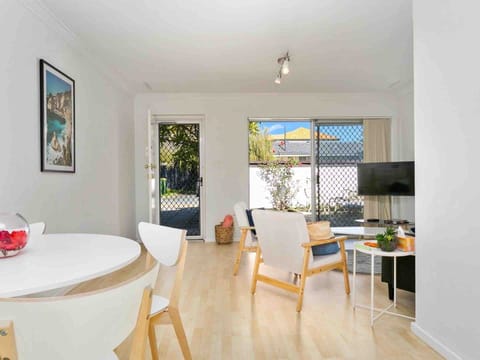 Modern comfort meets outdoor charm in this spacious living area, perfect for unwinding