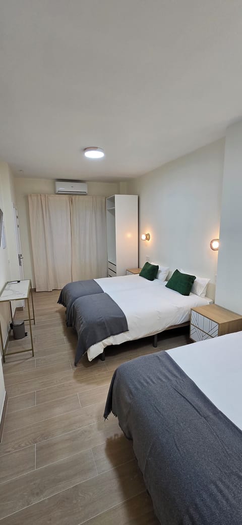 Quadruple Room, Balcony, City View | Down comforters, minibar, blackout drapes, soundproofing