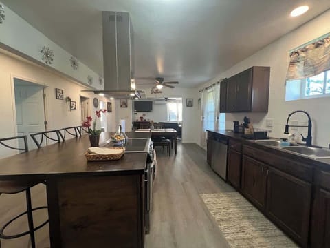 Center Island with fully equipped kitchen with air fryer microwave, Keurig and coffee maker,  waffle maker and basic condiments. 