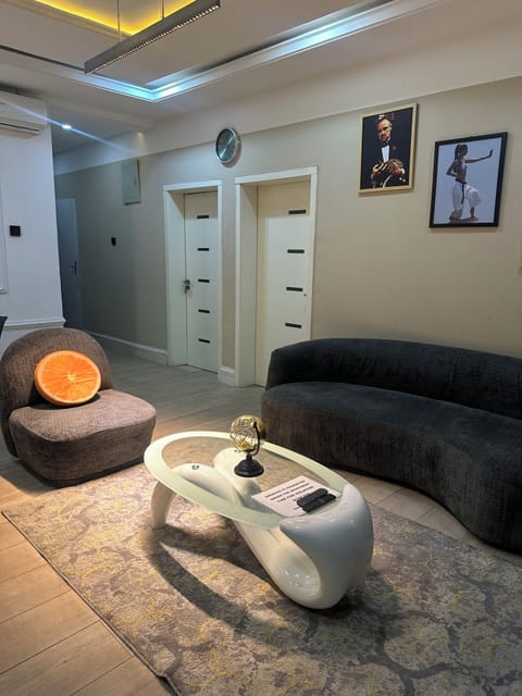 Deluxe Apartment, Balcony, City View | Living area | Flat-screen TV, video-game console