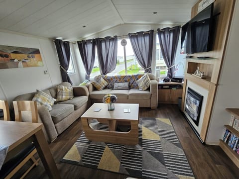 Cabin | Living area | TV, fireplace