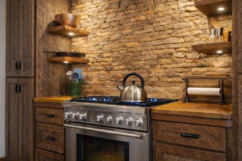 Fully equipped with high-end appliances and ample counter space, the kitchen is designed for both cooking and entertaining.