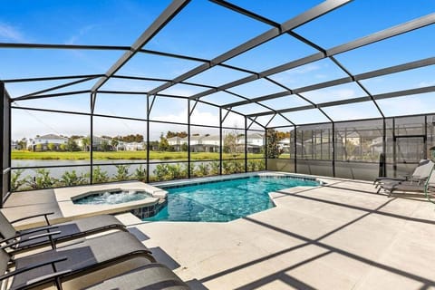 Imagine stepping onto a beautifully spacious pool deck, a stunning outdoor haven that seamlessly blends relaxation and breathtaking views of the lake