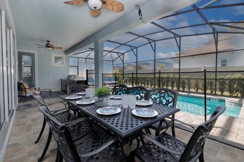 Enjoy a full outdoor kitchen with grill, sink, and fridge, plus a screened patio for privacy. The hot tub features a support rail for easy access. Want pool heat? Just let White Rose Villas know when booking!