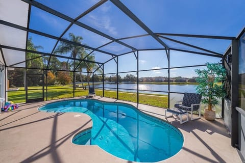 Immerse yourself in the ultimate relaxation at a resort-style pool that combines luxury, comfort, and breathtaking views of a serene lake.
