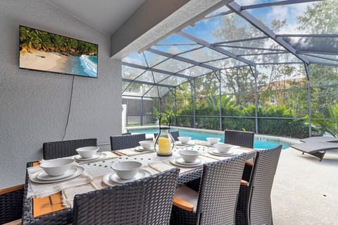 The outdoor dining area is a captivating space that seamlessly combines functionality with the beauty of its surroundings.