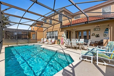 The pool itself is a sparkling oasis, inviting you to take a refreshing dip. Surrounding the pool, there are large shaded areas to offer respite from the sun.