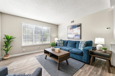 Relax in a bright Upper Westside apartment with smart TV and comfortable seating.