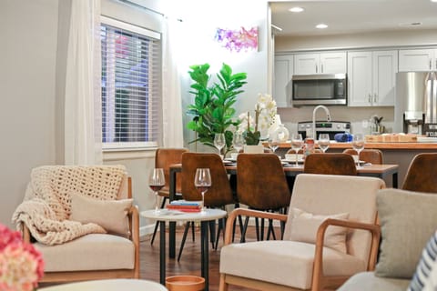 Main floor living room with seating for 7-8, open concept and pull-out couch sleeps 2 guests